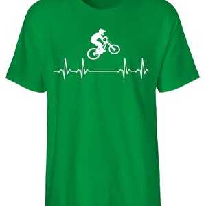 May include: Green t-shirt featuring a white silhouette of a person riding a mountain bike with a heartbeat graphic below.