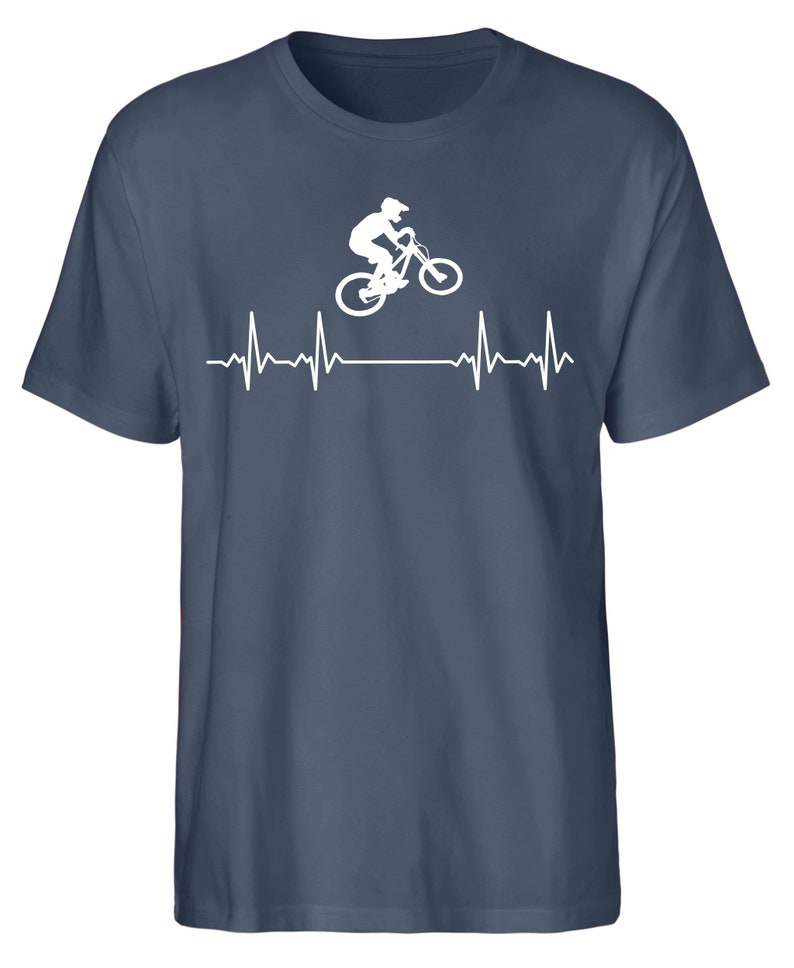 May include: A dark blue t-shirt featuring a white silhouette of a person riding a mountain bike with a heartbeat graphic below.