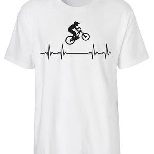 May include: White t-shirt featuring a black silhouette of a person riding a mountain bike and a heartbeat graphic.