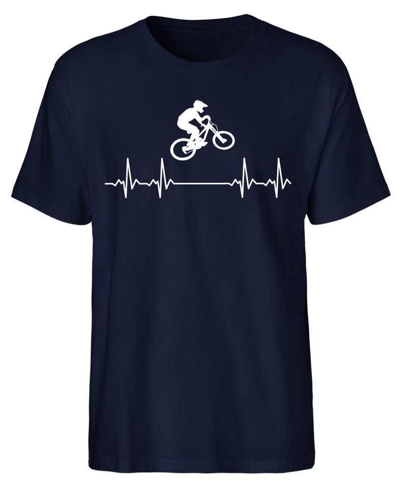May include: A navy blue t-shirt featuring a white silhouette of a person riding a mountain bike with a heartbeat graphic below.