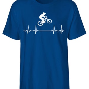 May include: A royal blue t-shirt featuring a white silhouette of a person riding a mountain bike over a white heartbeat graphic.