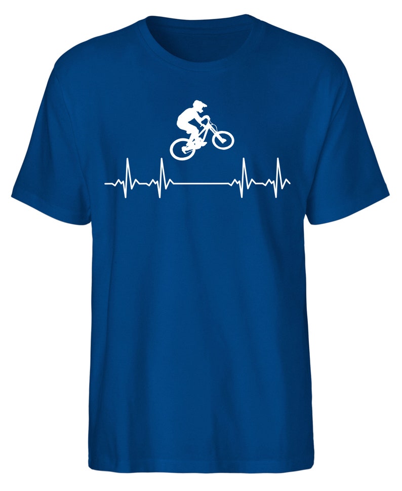 May include: A royal blue t-shirt featuring a white silhouette of a person riding a mountain bike over a white heartbeat graphic.