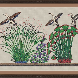 May include: Cross-stitch embroidery of three potted plants with birds flying above. The plants are in blue, red, and green pots. The birds are brown and white with red accents. The background is a light beige.