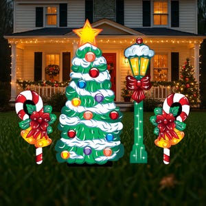 lighted Christmas tree outdoor yard sign, candy cane outdoor ornaments, winter lamp post outside Christmas decorations, holiday yard decor