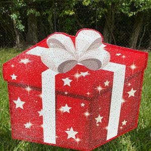 A Christmas Present Yard Decoration-bright and colorful gift box 3D design in green, red white with Christmas white stars and a red bow
