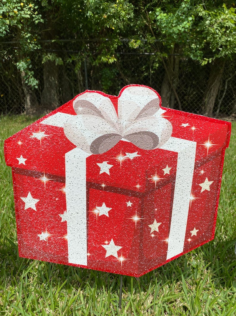 A Christmas Present Yard Decoration-bright and colorful gift box 3D design in green, red white with Christmas white stars and a red bow