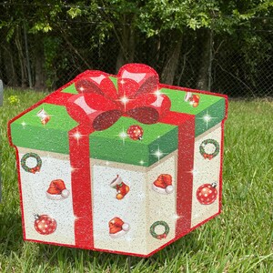 A Christmas Present Yard Decoration-bright and colorful gift box 3D design in green, red white with Christmas icons and a red bow