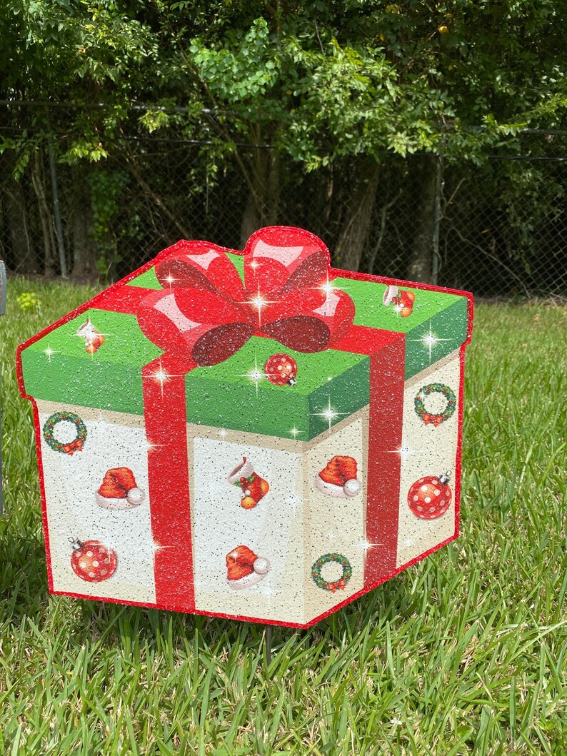 A Christmas Present Yard Decoration-bright and colorful gift box 3D design in green, red white with Christmas icons and a red bow