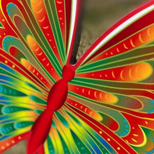 body of Orange and yellow butterfly garden stake, Orange and yellow butterfly garden stake:  whimsical orange butterfly lawn signs with playful patterns and vivid hues