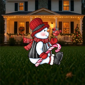 A mock up of an adorable snowman yard sign, complete with a candy cane, cozy scarf, and a sweet cardinal perched on his mitten!