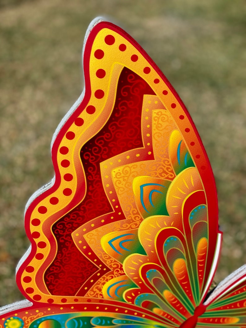 edge view of Orange and yellow butterfly garden stake:  Orange and yellow butterfly garden stake:  whimsical orange butterfly lawn signs with playful patterns and vivid hues
