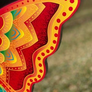 outline of Orange and yellow butterfly garden stake: Orange and yellow butterfly garden stake:  whimsical orange butterfly lawn signs with playful patterns and vivid hues