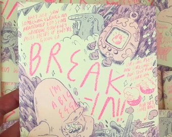 May include: A light green comic book cover with pink text that reads "I'm a Big Egg!" and "Break-In!" The cover features a cartoon character running with a large egg on its head. The background is a light green with a purple and pink design. The comic book is titled "Break-In!" and the author is Benjamin Wright.