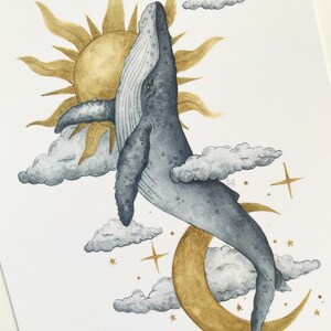 May include: Watercolor illustration of a whale breaching through clouds, with a golden sun and crescent moon in the background. The whale is gray, and the clouds are white and gray. Stars are scattered around the moon.