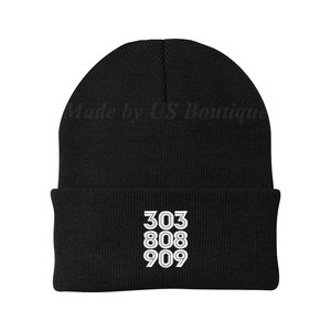 May include: Black knit beanie with white embroidered numbers 303, 808, and 909.