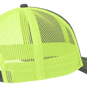 May include: A black and neon yellow trucker hat with a mesh back. The hat has a curved brim and a snap closure.