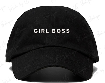 May include: A black baseball cap with a white embroidered inscription that reads "GIRL BOSS".
