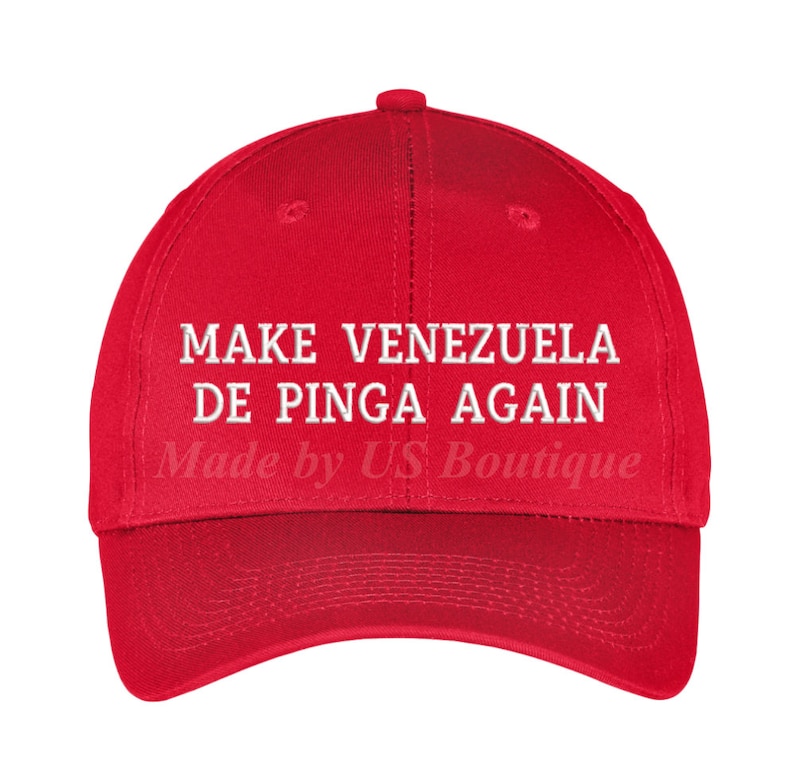 May include: Red baseball cap with white embroidered text that reads "Make Venezuela De Pinga Again" and "Made by US Boutique".