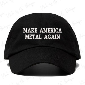 May include: A black baseball cap with white embroidered text that reads "MAKE AMERICA METAL AGAIN".