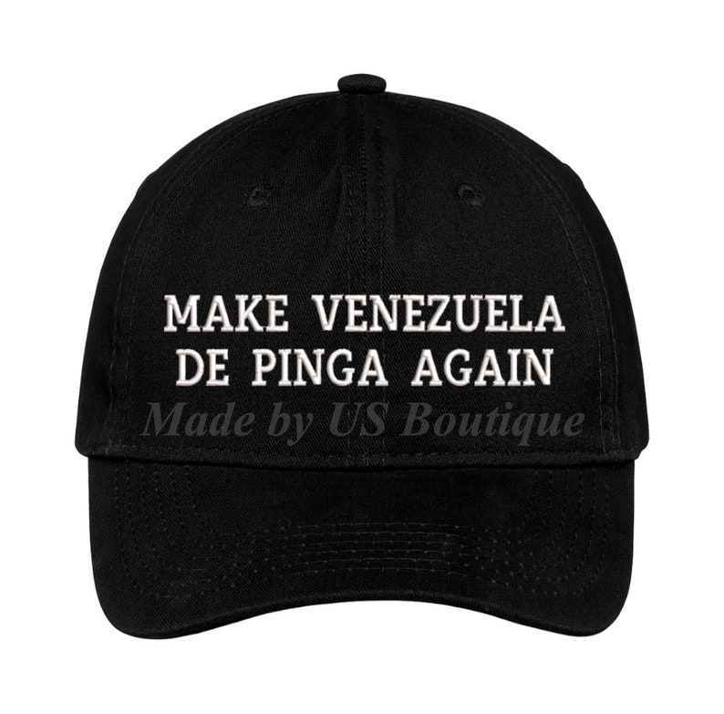 May include: Black baseball cap with white embroidered text that reads "MAKE VENEZUELA DE PINGA AGAIN" and "Made by US Boutique".