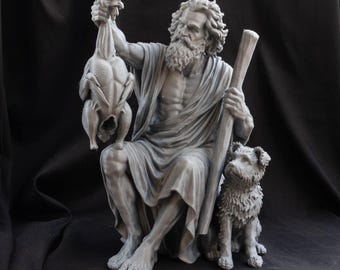 May include: A grey monochromatic sculpture of a bearded figure in draped robes, seated while holding a chicken in one hand and a tall staff in the other. A small, shaggy-haired dog sits beside the figure, looking upward toward the chicken.