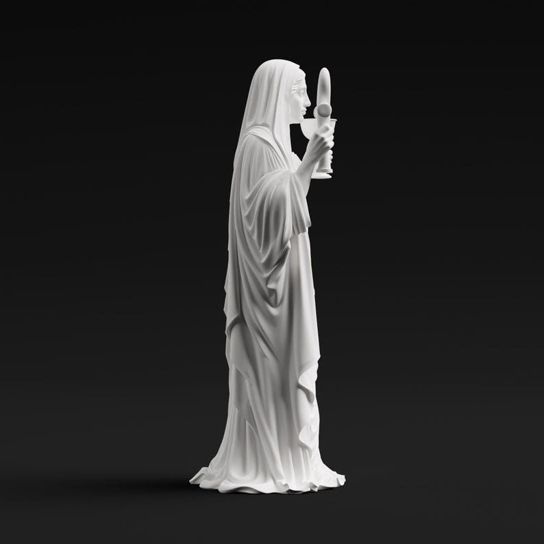 May include: A white matte statue of a figure draped in long, flowing robes and a head covering. The figure is shown in profile, holding a tall, slender chalice-like object with both hands near the face, featuring detailed folds in the fabric.
