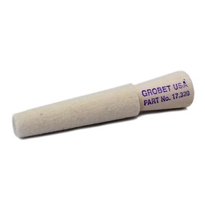 May include: A white felt polishing cone with a wooden handle. The handle is labeled "GROBET USA PART No. 17.320".