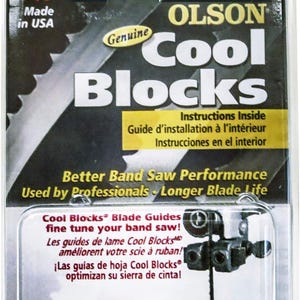May include: A package of Olson Cool Blocks blade guides for band saws. The package is white with black text and a red, white, and blue American flag. The text on the package reads "Olson Cool Blocks" and "Instructions Inside". The package also includes a picture of a band saw blade and the Cool Blocks.