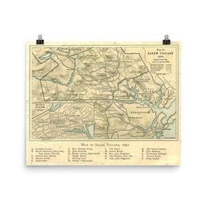 May include: An antique map of Salem Village, Massachusetts, from 1692. The map is in shades of green, brown, and blue, with handwritten text labels and a key identifying locations and people. The map shows the layout of the village, including roads, houses, and landmarks.
