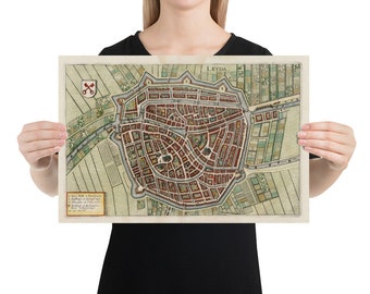 May include: A vintage map of the city of Leyda, Netherlands, with detailed streets and buildings. The map is printed on a cream-colored paper with a light brown border.
