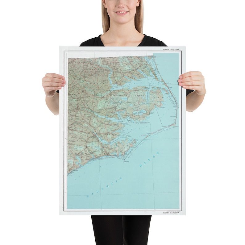 May include: A map of the Outer Banks region of North Carolina, showing the coastline, waterways, and surrounding land. The map is printed on a white background with blue and green colors.