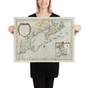 May include: An antique map of the coast of North America, with detailed markings and a title in Latin. The map is printed on aged paper with a cream background and features a compass rose and a scale.
