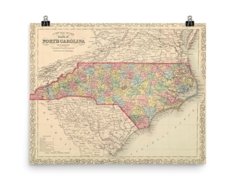 May include: A vintage map of North Carolina, printed in black, red, blue, green, and yellow. The map shows the state's counties and major cities. The map is surrounded by a decorative border.