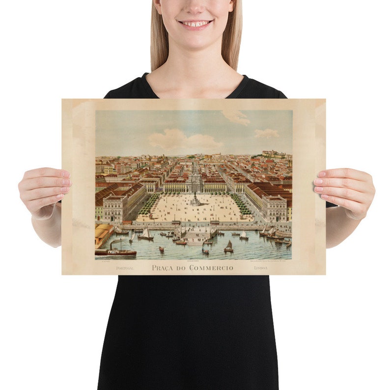 May include: A vintage print of Pra&ccedil;a do Com&eacute;rcio in Lisbon, Portugal. The print depicts a detailed aerial view of the square, buildings, and harbor with boats. The print has a sepia tone and the text "Pra&ccedil;a do Com&eacute;rcio" is visible.