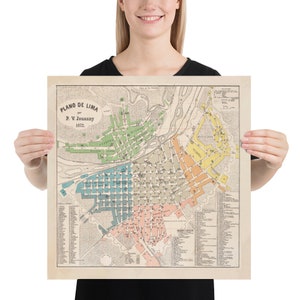 May include: A vintage map of Lima, Peru, titled "Plano de Lima" by P.V. Jouanny, 1872. The map is printed in black and white with colored sections highlighting different areas of the city. The map includes street names and other details.