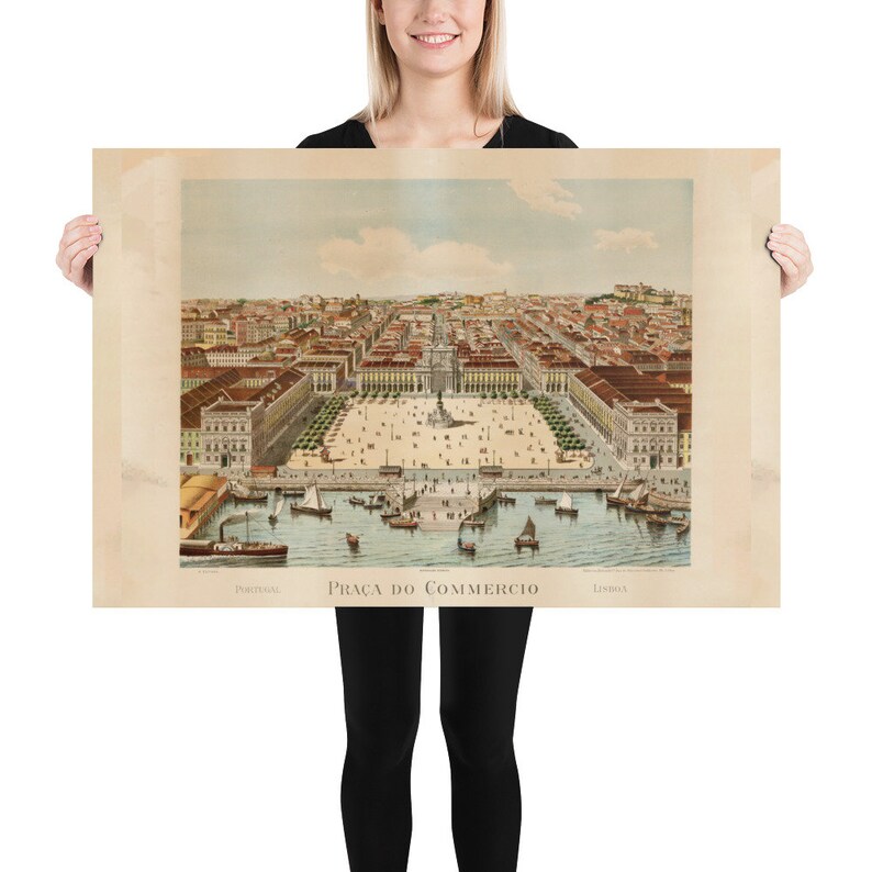 May include: Vintage print of Pra&ccedil;a do Com&eacute;rcio in Lisbon, Portugal. The print depicts a detailed aerial view of the square, buildings, and harbor with boats. The print has a sepia tone and the text "Portugal" and "Lisboa" are visible.