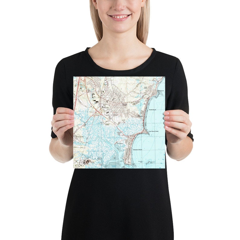 May include: A vintage map of Tybee Island, Georgia, showing the coastline, roads, and landmarks. The map is printed on white paper with blue and brown lines.