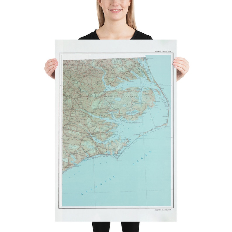 May include: A vintage-style map of North Carolina, showing the state's coastline, rivers, and major cities. The map is printed on white paper and has a light blue background.