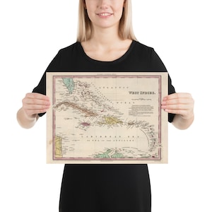 May include: An antique map of the West Indies, printed on paper with a cream background. The map shows the islands of the Caribbean Sea, including Cuba, Hispaniola, Puerto Rico, Jamaica, and the Lesser Antilles. The map is titled "West Indies."