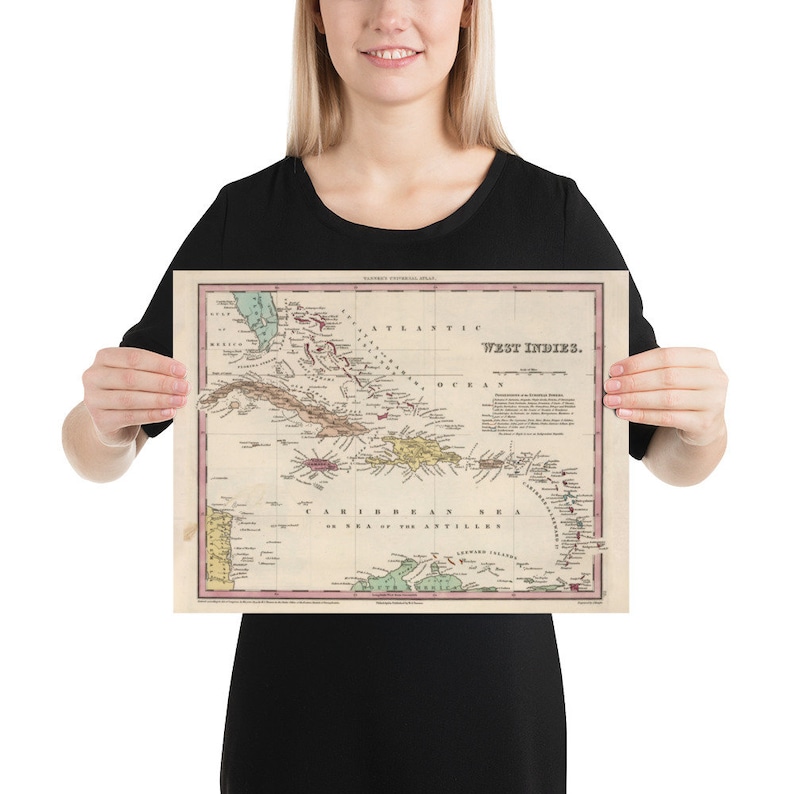May include: An antique map of the West Indies, printed on paper with a cream background. The map shows the islands of the Caribbean Sea, including Cuba, Hispaniola, Puerto Rico, Jamaica, and the Lesser Antilles. The map is titled "West Indies."