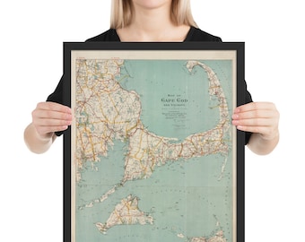 May include: A vintage map of Cape Cod and its vicinity, framed in black. The map is printed on a light blue background with brown and red lines representing roads and waterways. The title "Map of Cape Cod and Vicinity" is printed in the center of the map.