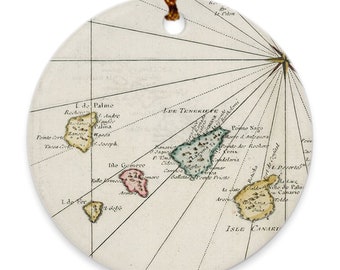 May include: An antique map of the Canary Islands, showing the islands of Tenerife, Gomera, Palma, and Hierro. The map is in a circular format and features a compass rose and lines of longitude and latitude.