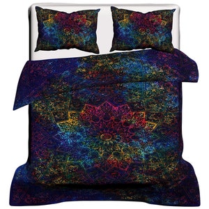 May include: A blue, multi-colored mandala patterned bedding set with two matching pillowcases. The bedding is made of cotton and features a tie-dye design.