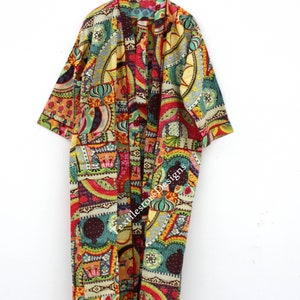 May include: A long, colorful kimono with a patchwork design featuring geometric shapes, paisley patterns, and floral motifs. The kimono is made of cotton and has a relaxed fit.