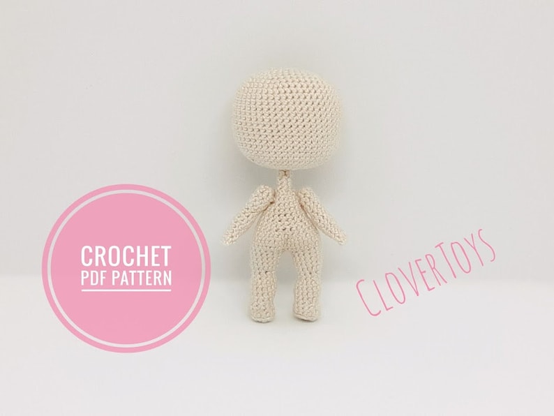 May include: A crochet doll pattern, with the text "CROCHET PDF PATTERN" and "CLOVERTOYS" on the image.
