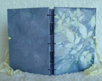 Eco printed book (including the cover).  Each handmade, fabric-bound, hand-stitched book contains 40 unique botanical boiled book images.
