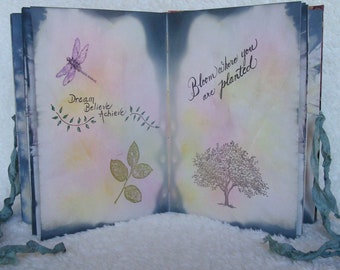 Eco printed book.  Each handmade, fabric-bound, hand-stitched book contains 40 unique botanical boiled book pages.