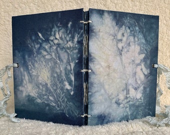 Eco printed book (including the cover).  This handmade, fabric-bound, hand-stitched book contains 40 unique botanical boiled book images.