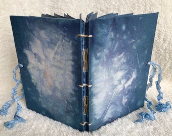Eco printed book (including the cover).  This handmade, fabric-bound, hand-stitched book contains 40 unique botanical boiled book images.