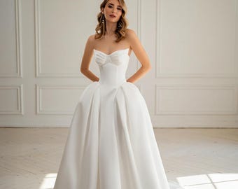 Minimalistische satijnen strapless trouwjurk, moderne korset bruidsjurk